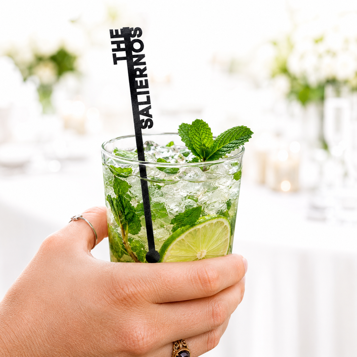Black vertical The Salernos name stir stick in a mojito