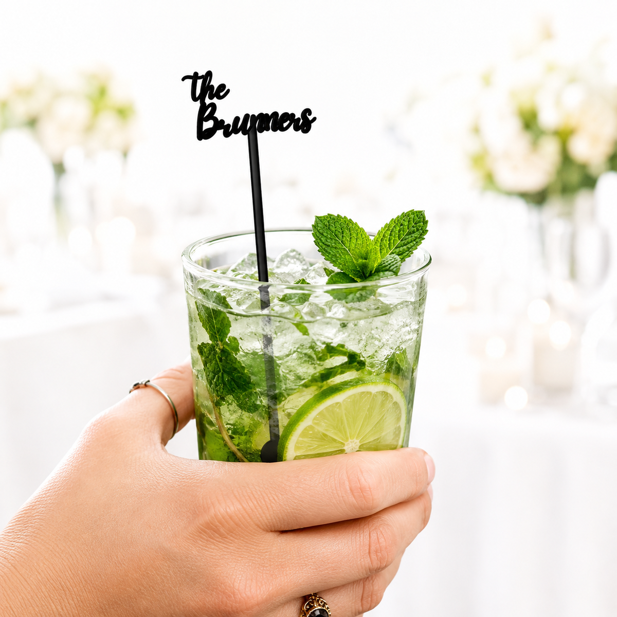 Black script The Brunners name stir stick in a mojito